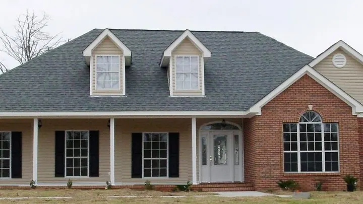 The Princeton plan: brick and siding home with two dormers and a long front porch